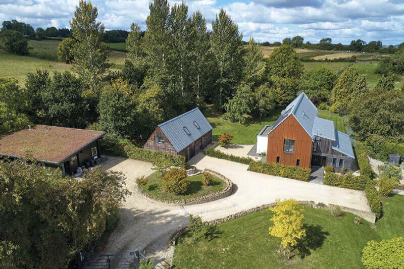 The gardens were thoughtfully landscaped to get the most out of the varying levels on this plot. Extensive groundworks were carried out to create the access to the potting shed, garages and house.