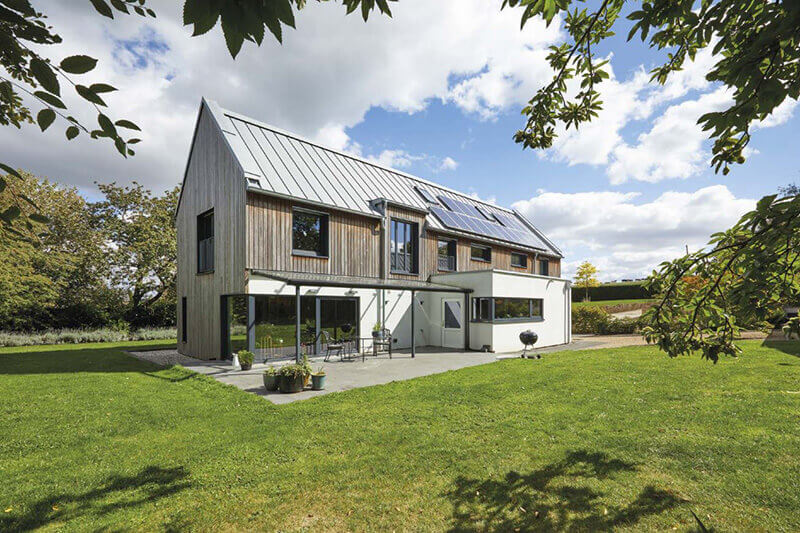 The materials used to embrace this project compromise of Zinc roofs, cedar cladding, monocouche render and architectural glass to create the exterior footprint of the house. The solar panels with the air source heat pump generate the heating for the house for it to be sustainable.