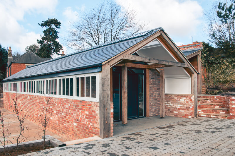 The oak structure made in our own joinery workshop, built with hidden steelwork to support the existing structure.