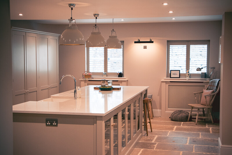 Re-designed layout and new stone floors were laid to complete the handmade kitchen. Layout of old kitchen  changed to create and open dining/kitchen space.