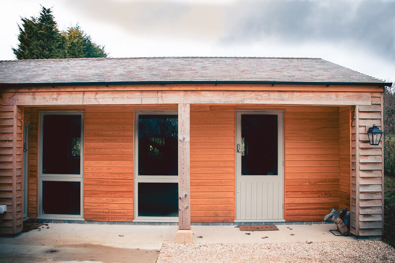 Larch wood cladding with cedar roof – all fire rate due to the proximity of boundaries.