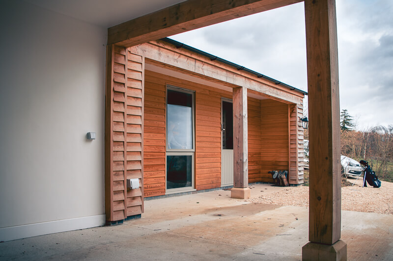 Installation of outdoor electrical points; Electrical car chargers installed in parking area. Timber frame fronted parking spaces created by our in house joinery company.