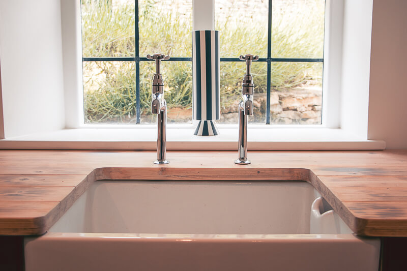 Bespoke utility worktop made by our joinery company. Taps were installed in accordance with the client's own specification.